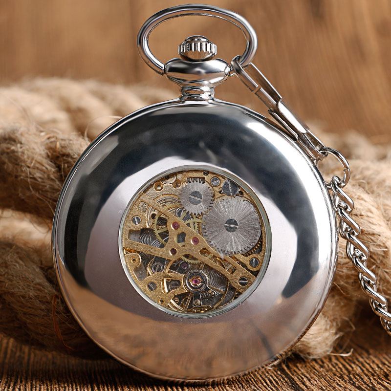 Vintage silver mechanical pocket watch showcasing intricate gears and elegant design, perfect for timeless style.