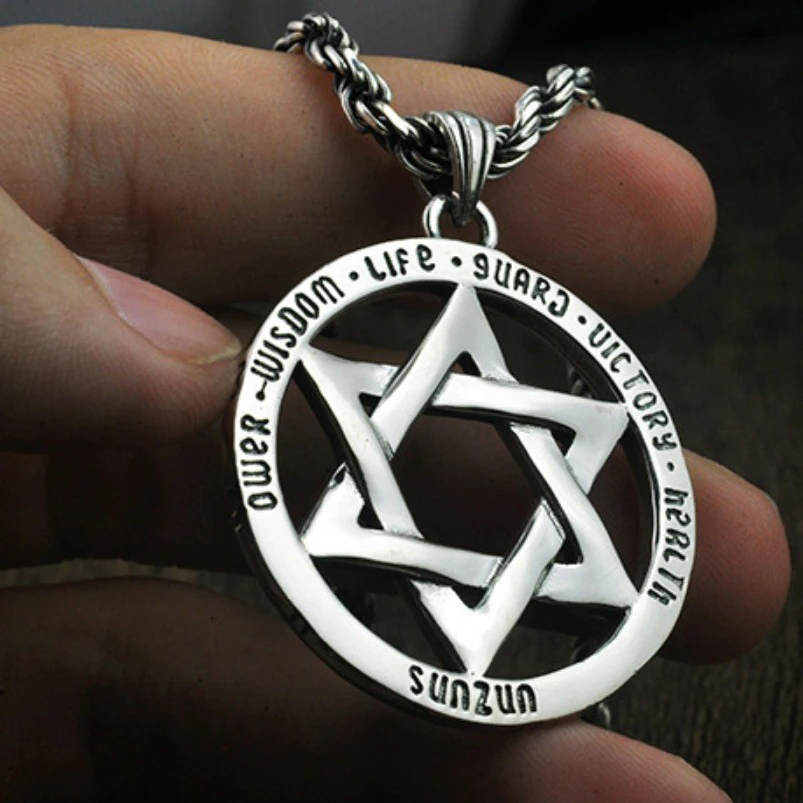 Vintage silver hexagram pendant with powerful symbols, perfect for stylish jewelry enthusiasts.