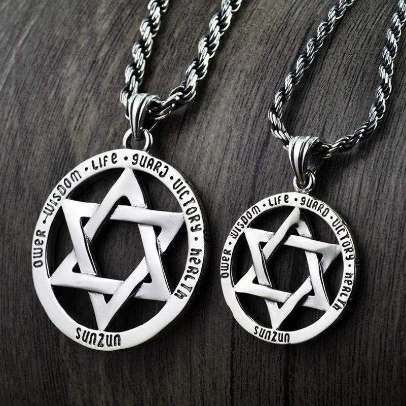 Vintage silver hexagram pendants showcasing intricate design and meaningful inscriptions on stylish chains.