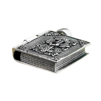 Vintage silver pendant shaped like a religious book, detailed and stylish sterling silver jewelry accessory.