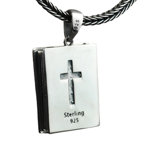 Vintage sterling silver religious pendant in the shape of a book with a cross design. Perfect stylish accessory!