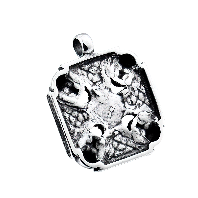 Vintage stainless steel pendant featuring intricate Viking-Celtic design with skulls and snake eye, perfect gothic accessory.