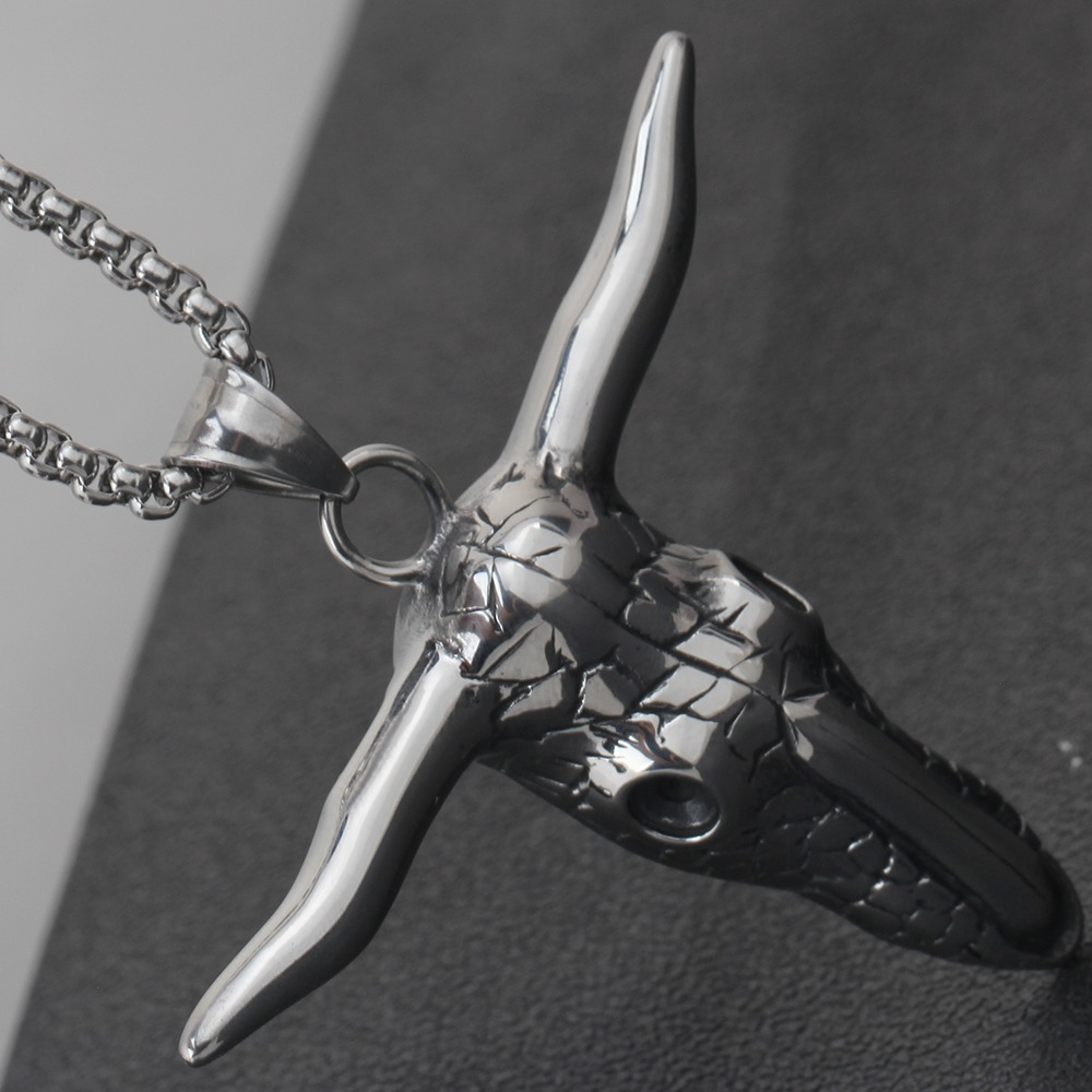 Vintage stainless steel bull head pendant necklace, perfect for alternative fashion and concert outfits.