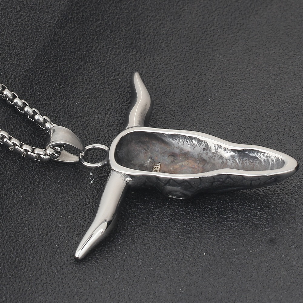 Vintage stainless steel bull head pendant necklace, perfect for alternative fashion and concert outfits.