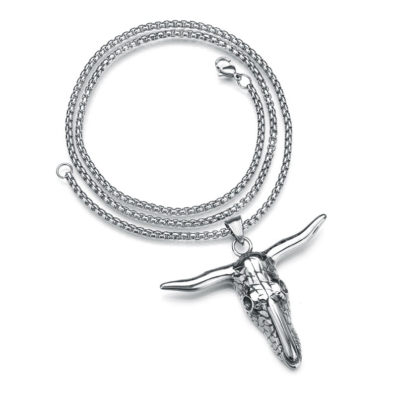 Vintage stainless steel bull head pendant necklace, perfect for alternative fashion and concert outfits.