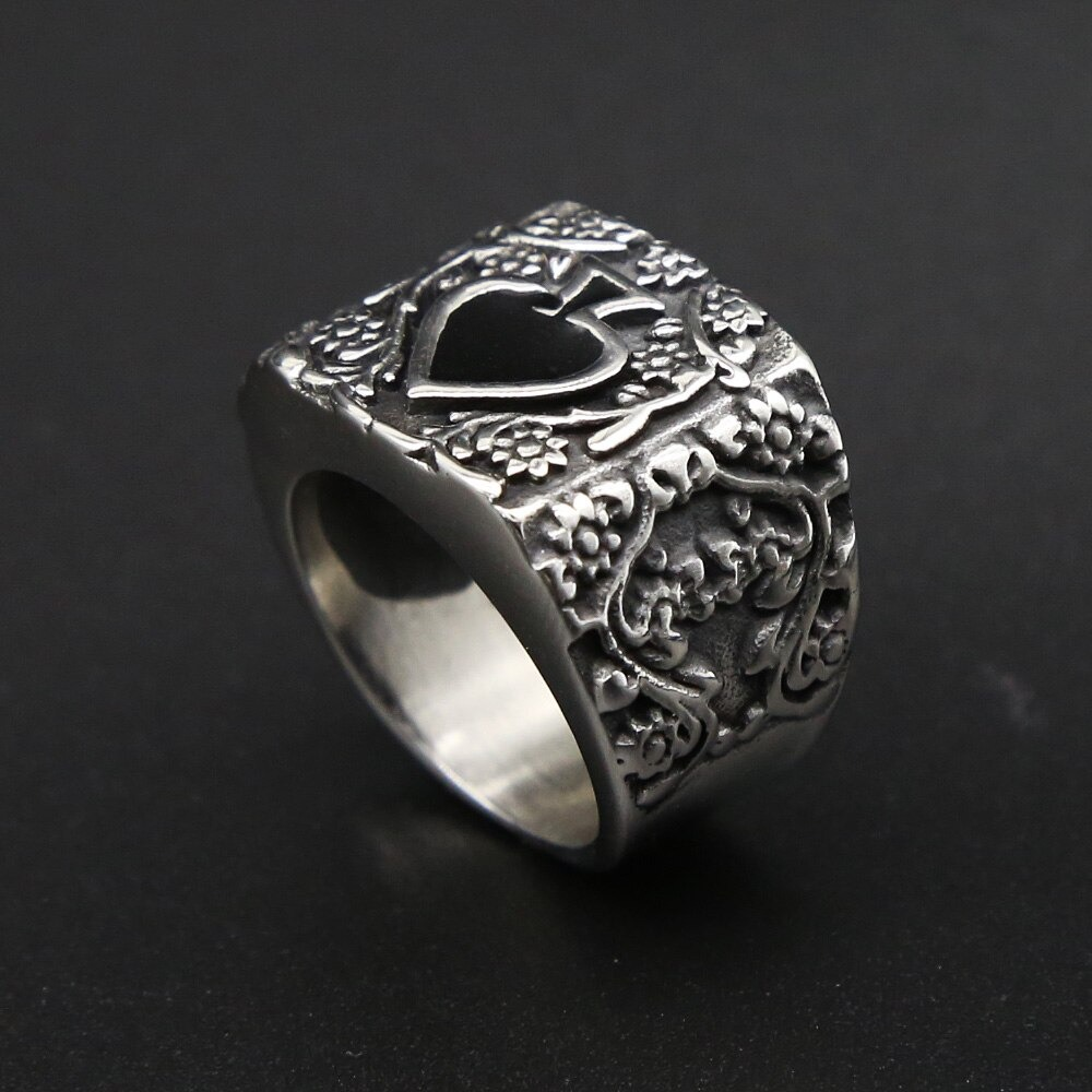 Vintage stainless steel men's ring with heart design, perfect for a rock-style jewelry collection.