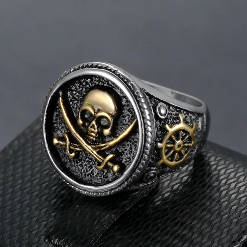 Vintage stainless steel pirate skull ring featuring gold accents and crossed swords, perfect for punk style enthusiasts.