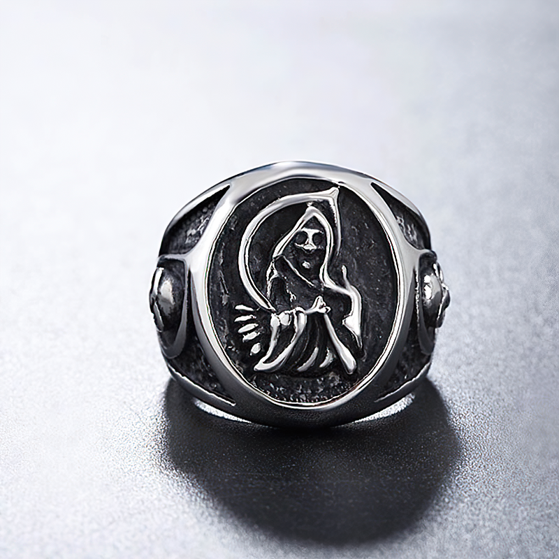 Vintage stainless steel reaper skull ring featuring a detailed death figure, perfect for Gothic jewelry lovers.