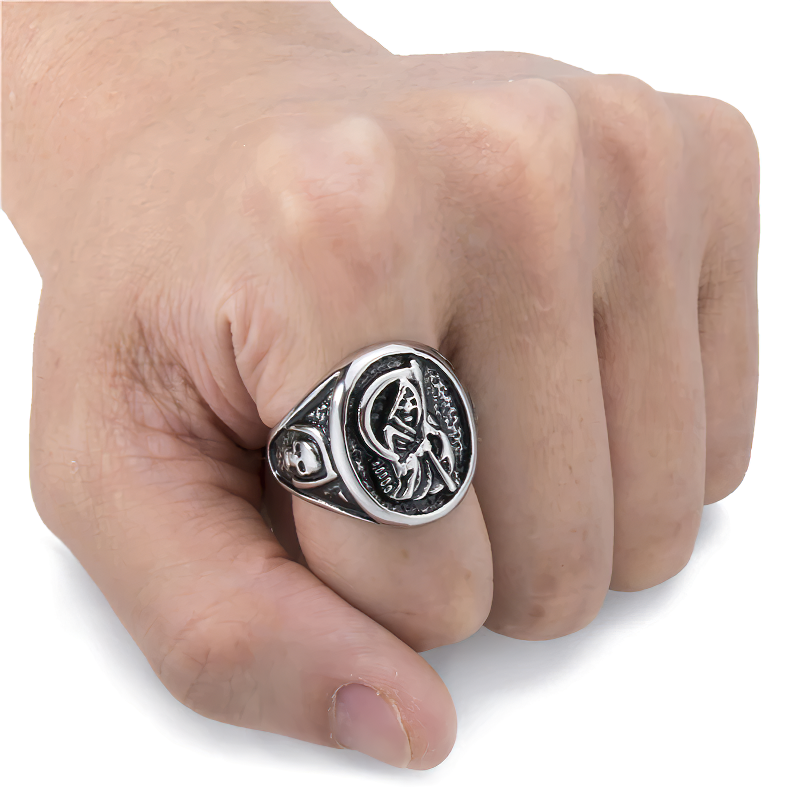 Vintage stainless steel skull ring worn on hand, showcasing Gothic design and unique craftsmanship.