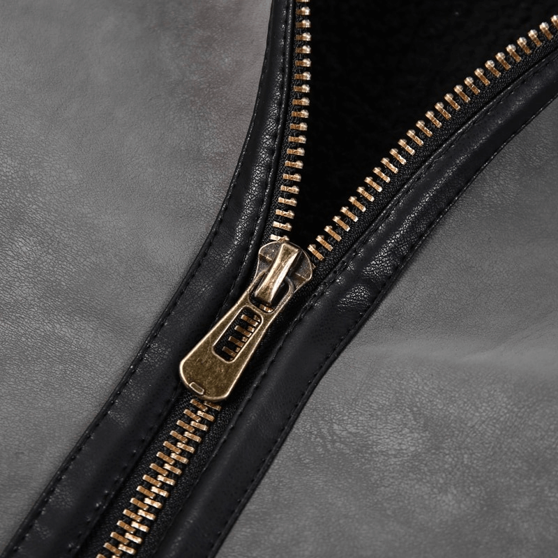 Close-up of the zipper on a vintage leather motorcycle jacket, showcasing quality craftsmanship and stylish design.