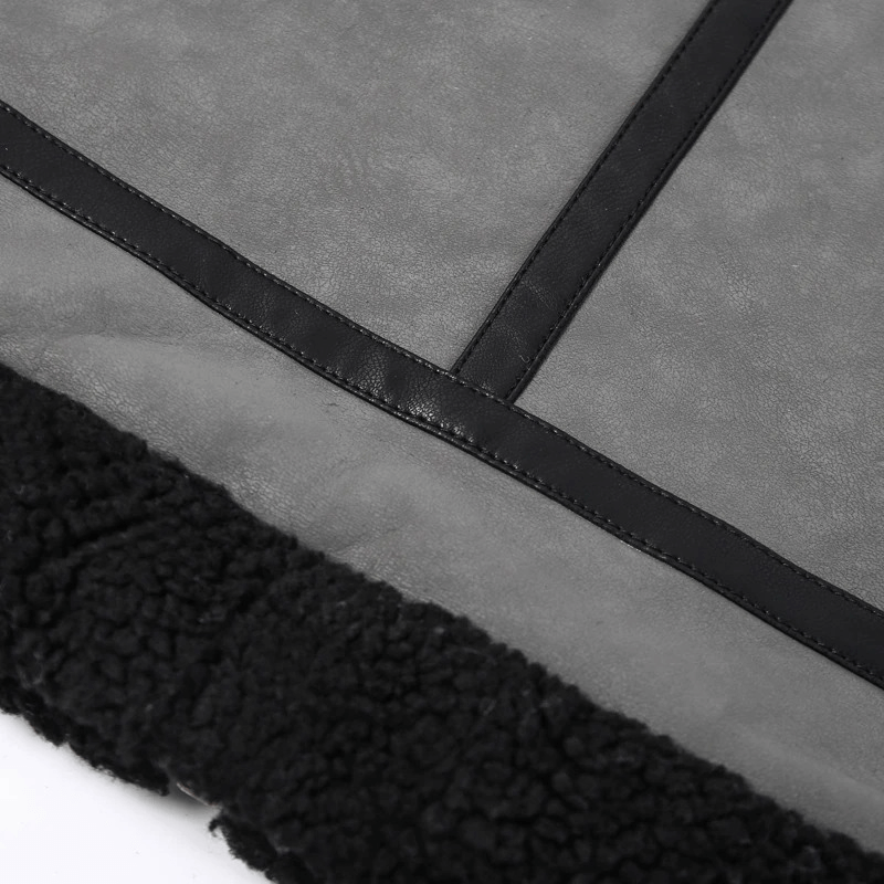 Close-up of a vintage leather jacket featuring a soft black fur lining and stylish stitching details.