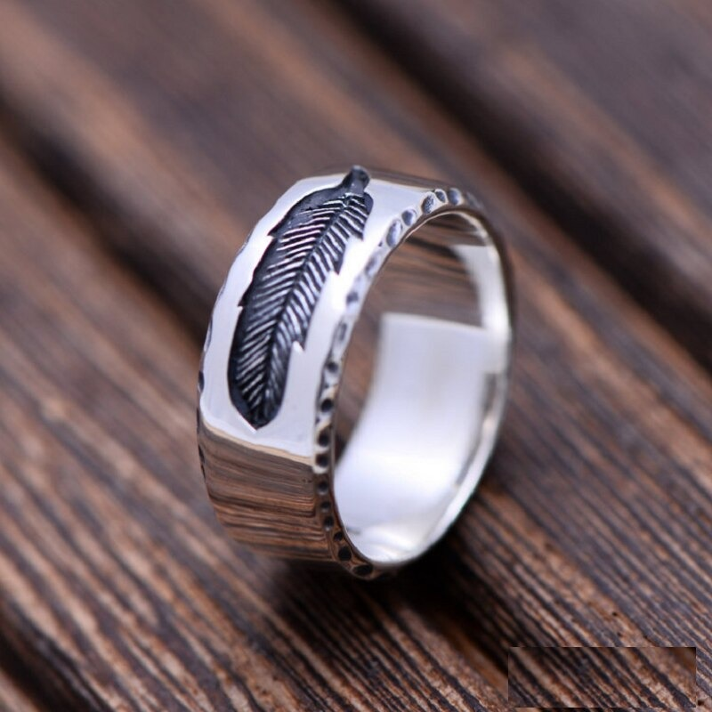 Vintage unisex sterling silver ring featuring a stylish feather design, perfect for adding flair to any outfit.