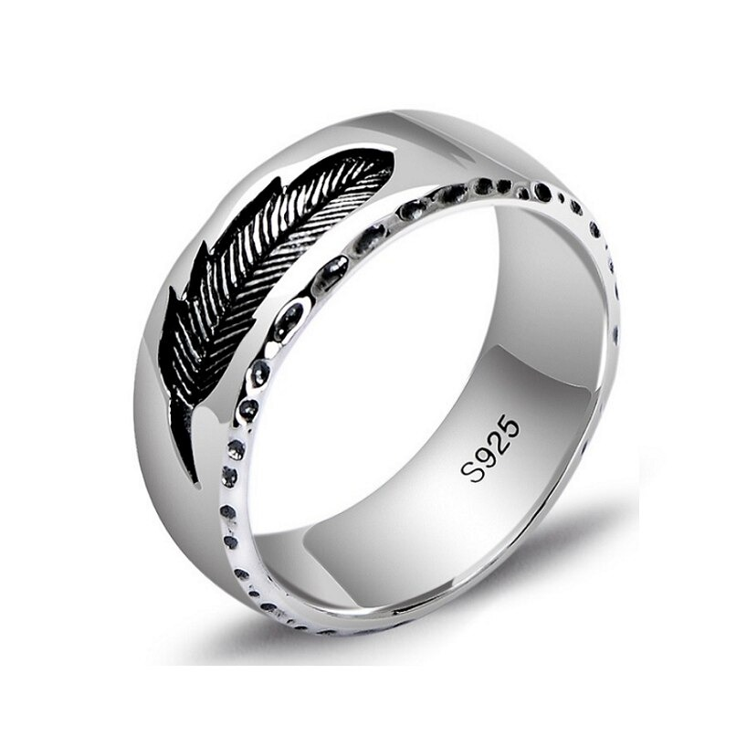Vintage unisex sterling silver ring featuring a sleek feather design for a stylish accessory.