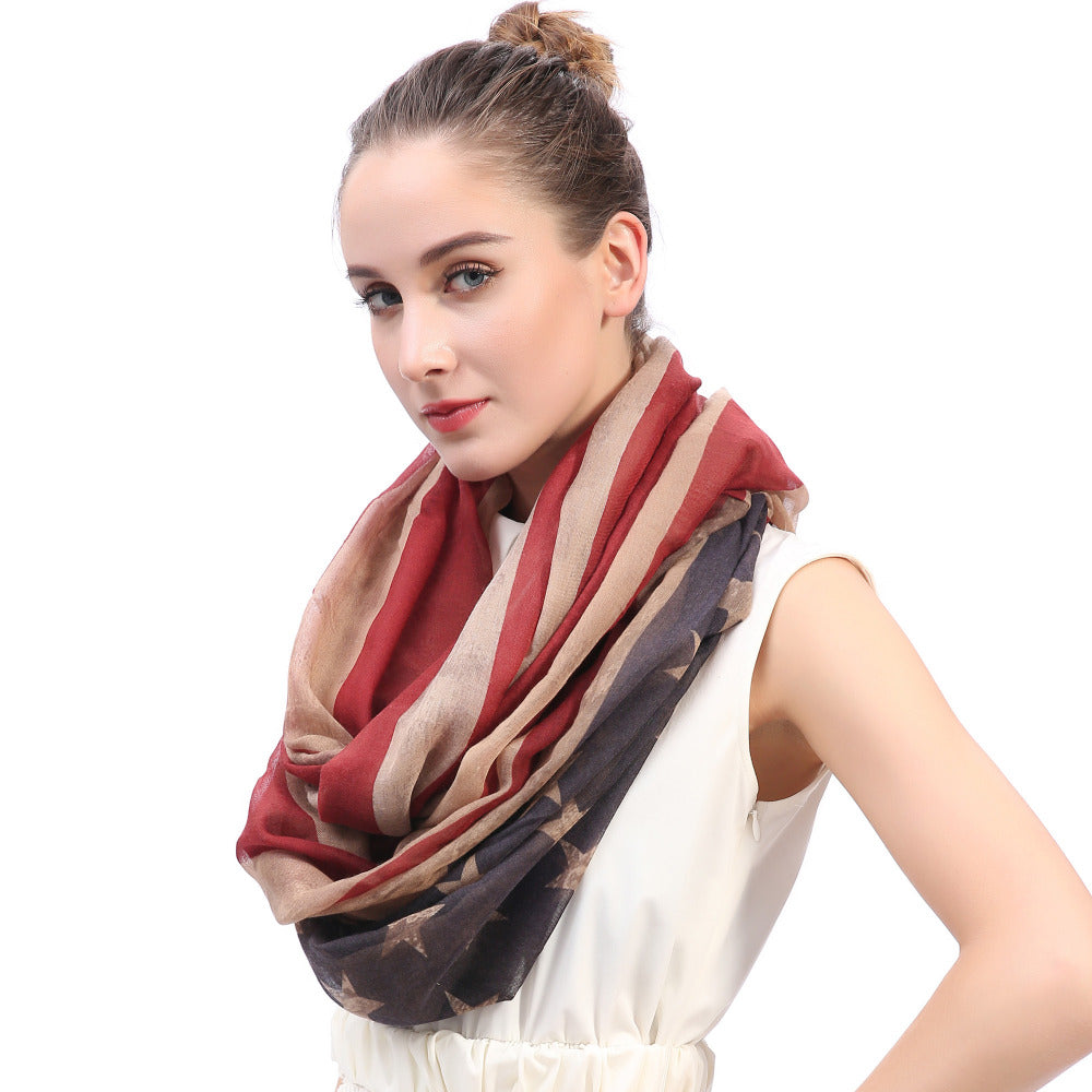 Stylish woman wearing a vintage USA flag print infinity loop scarf, showcasing trendy accessory fashion.