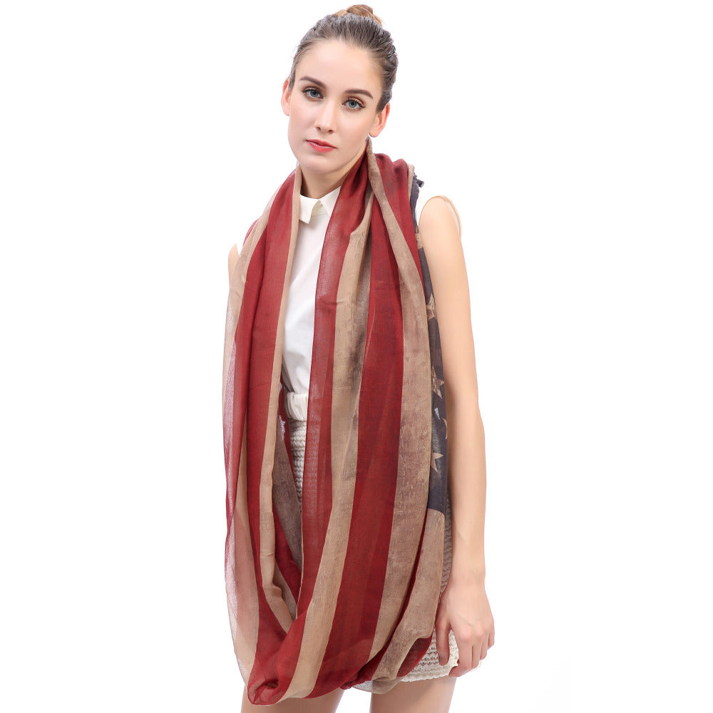 Woman wearing a vintage USA flag printed infinity loop scarf, showcasing its stylish soft fabric and trendy design.