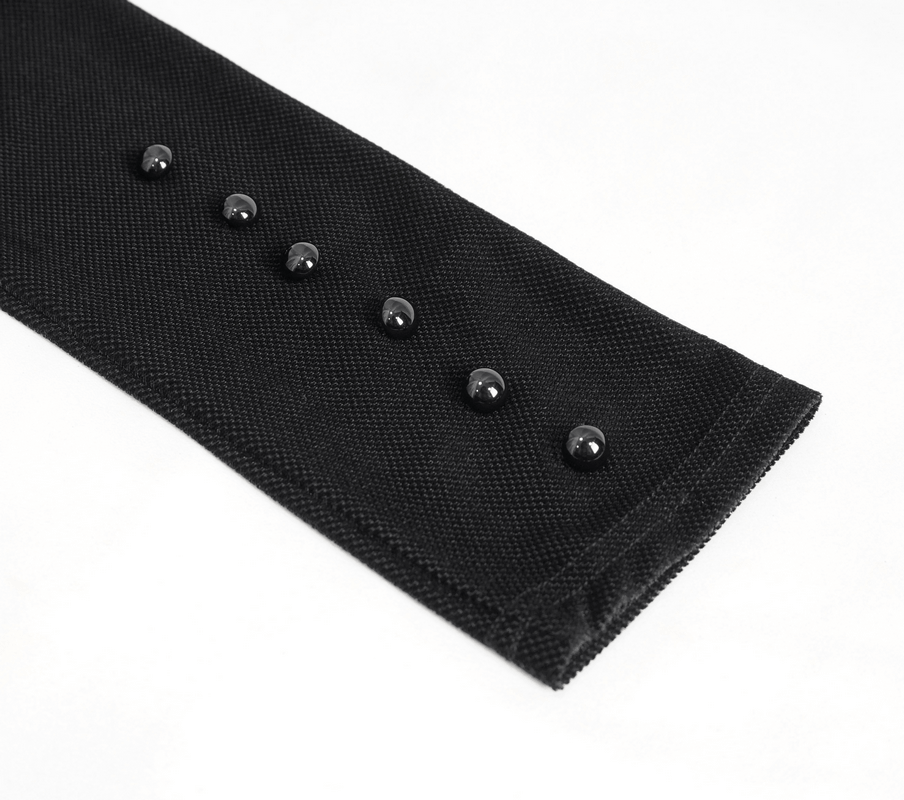 Close-up of black fabric sleeve featuring stylish black buttons for vintage elegance.