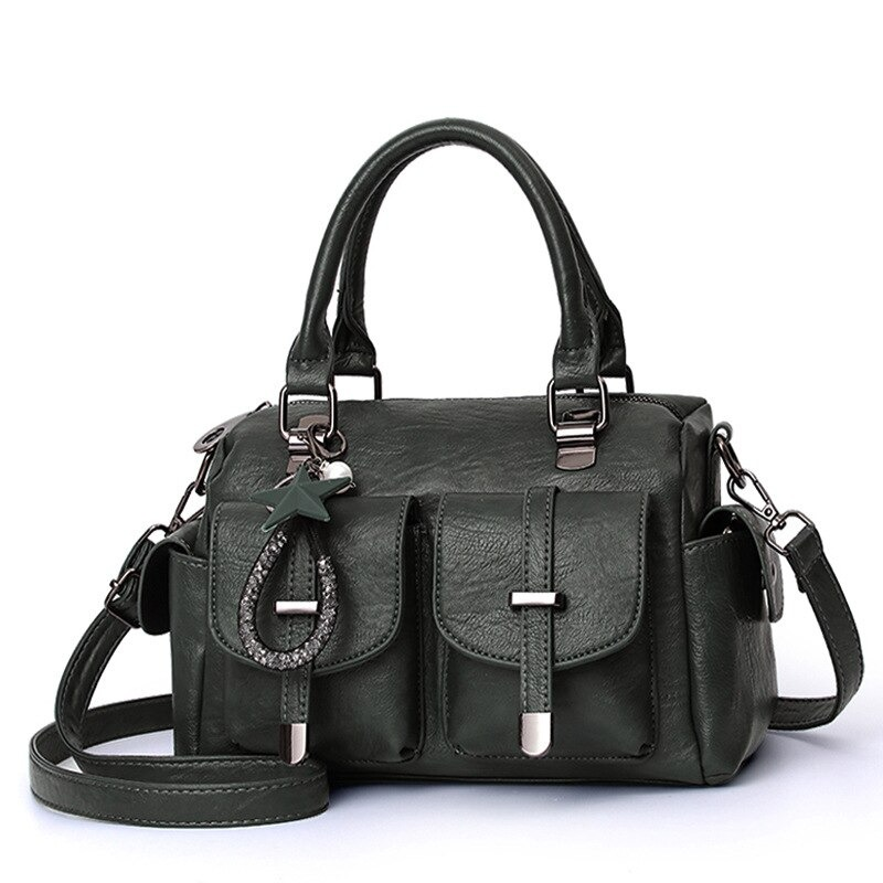 Vintage women handbag in green soft leather with star pendant, stylish multi-pocket shoulder bag.
