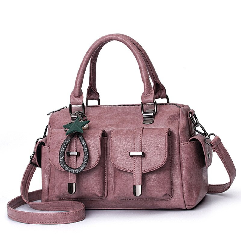 Vintage soft leather women's handbag with star pendant and multi-pockets in soft pink.