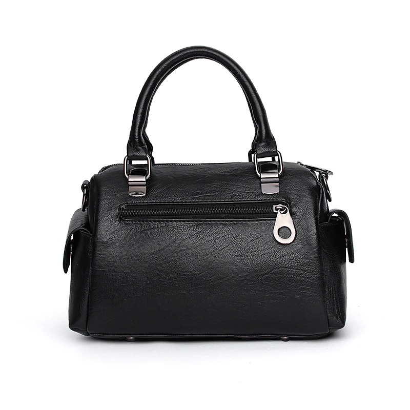 Vintage women handbag in black soft leather with zipper and top handle, perfect for stylish everyday use.