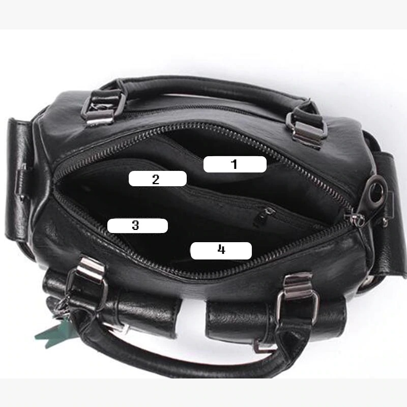 Interior view of a vintage women's soft leather handbag showing multi-pocket design and compartments.