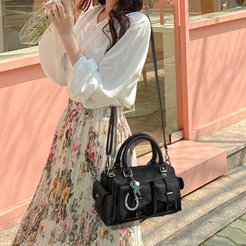 Stylish vintage women handbag with star pendant, soft leather and multi-pocket design, perfect for any outfit.