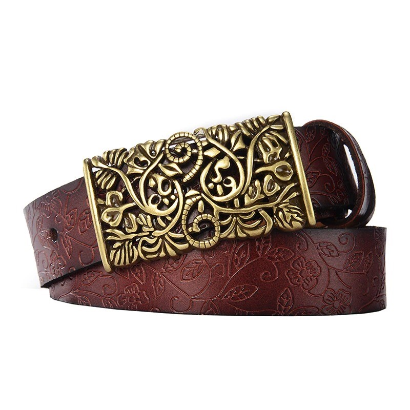 Vintage women's leather belt with ornate metal flower buckle, ideal for gothic or stylish outfits.