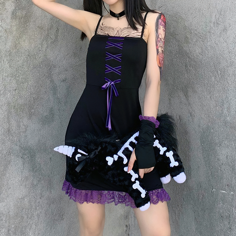 Vintage black lace gothic dress with purple accents and ruffle hem, paired with a playful plush accessory.