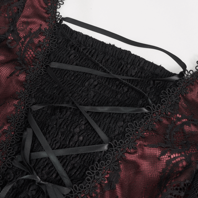 Close-up of vintage women's sexy party dress showcasing intricate lace and deep V-neck design in wine red and black.