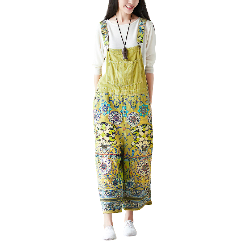 Vintage women's wide-leg jumpsuit in yellow with floral print, stylish and unique perfect for a bright outfit.