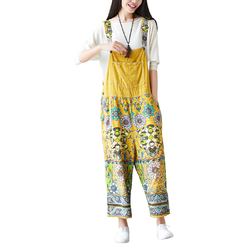 Vintage women's wide-leg pants in yellow with floral psychedelic prints, perfect for a stylish, vibrant look.