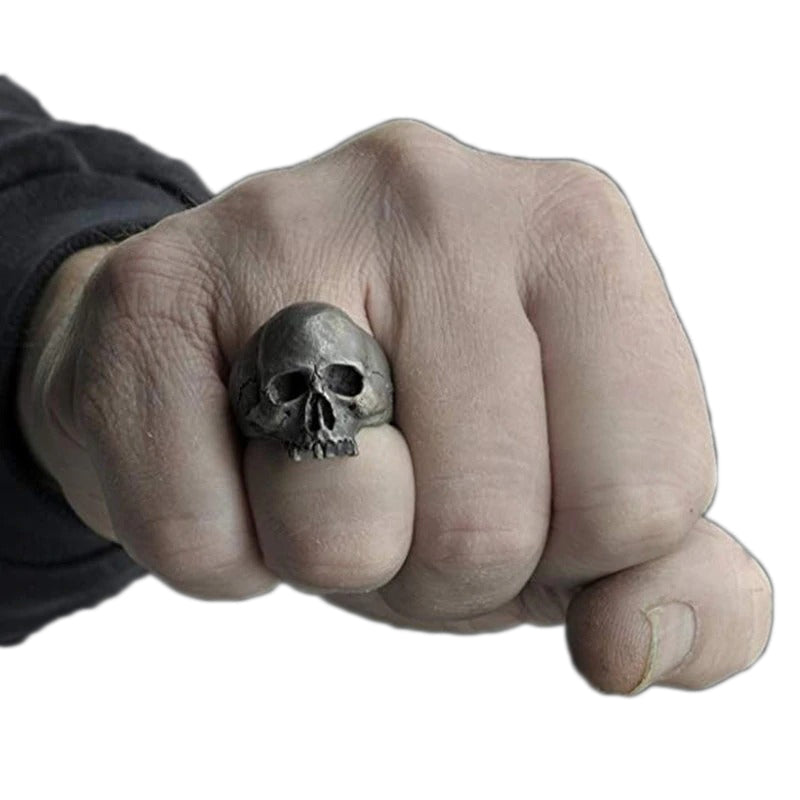 Hand wearing a vintage zinc alloy skull ring, showcasing an edgy Gothic style for bikers.