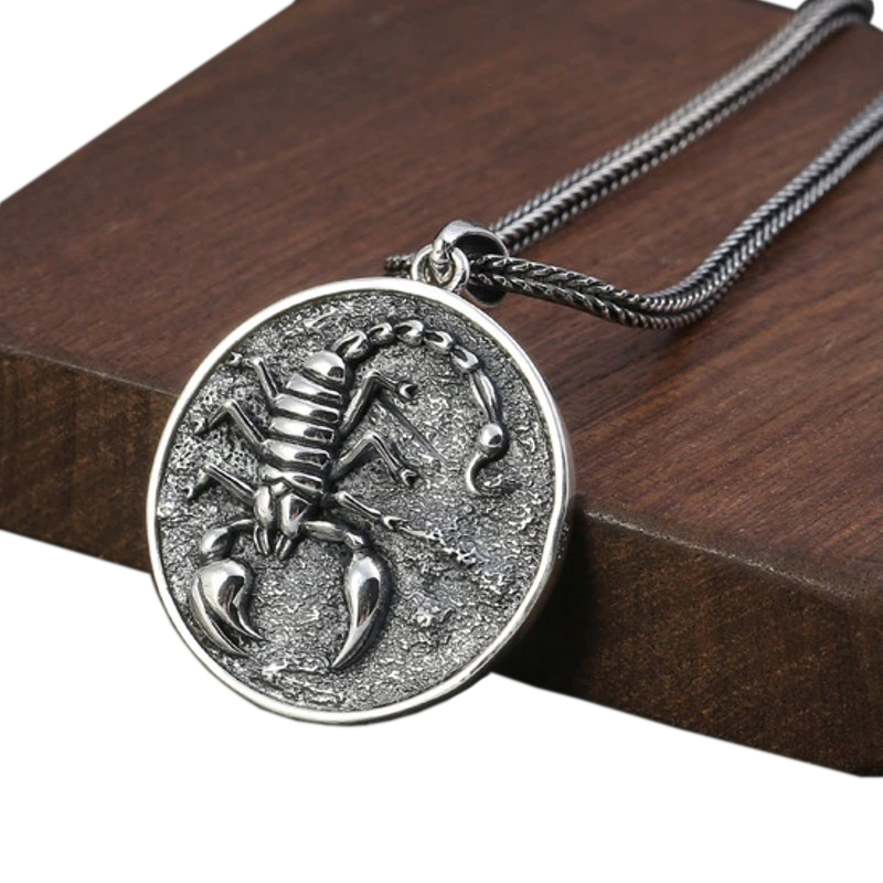 Vintage rock style unisex silver pendant featuring a detailed scorpion design on a textured background.