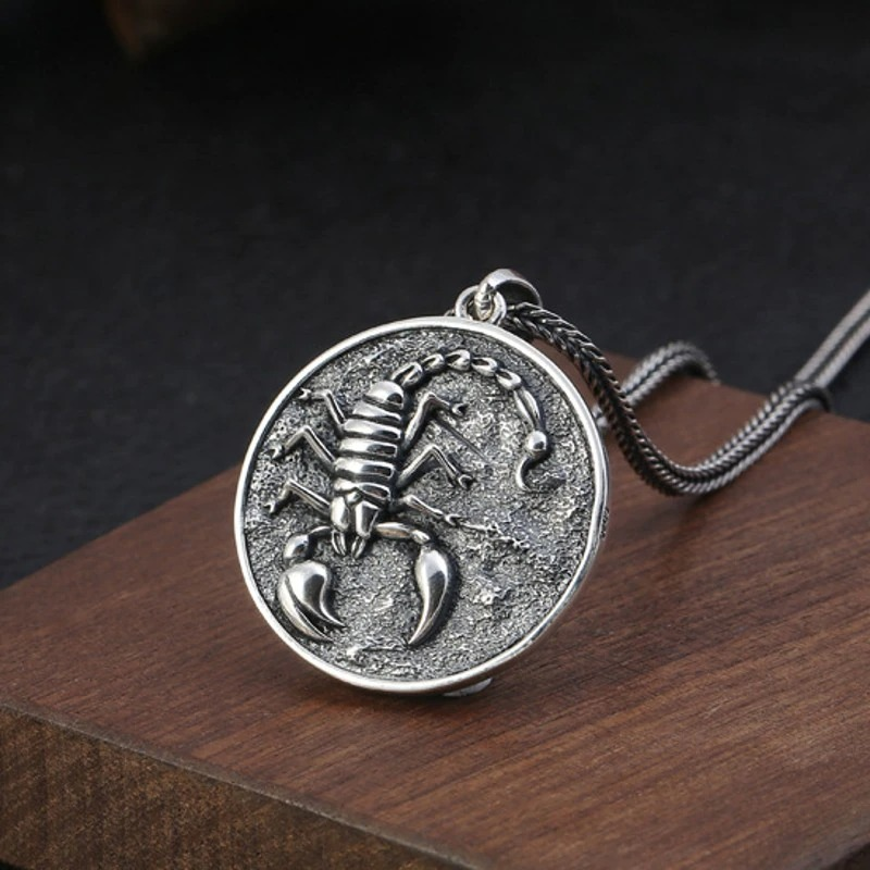 Vintdge rock style silver pendant with scorpion design on wooden background, perfect for unisex jewelry enthusiasts.