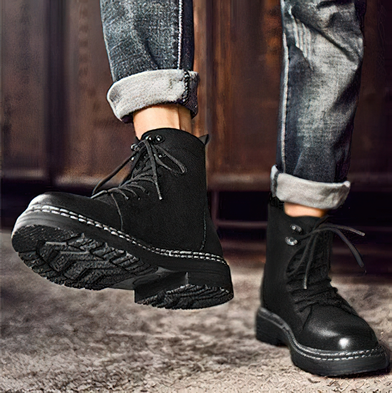 Men's black leather ankle boots with wear-resistant sole, styled with casual jeans, perfect for everyday comfort.