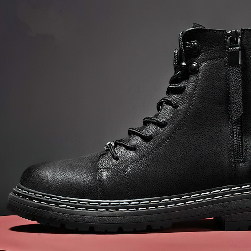 Stylish men's black leather ankle boot with laces and zipper, perfect for casual wear and comfort.