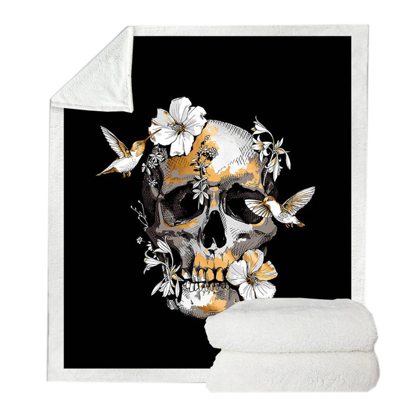 Warm black blanket with 3D skull and floral print, perfect for gothic decor and cozy nights.
