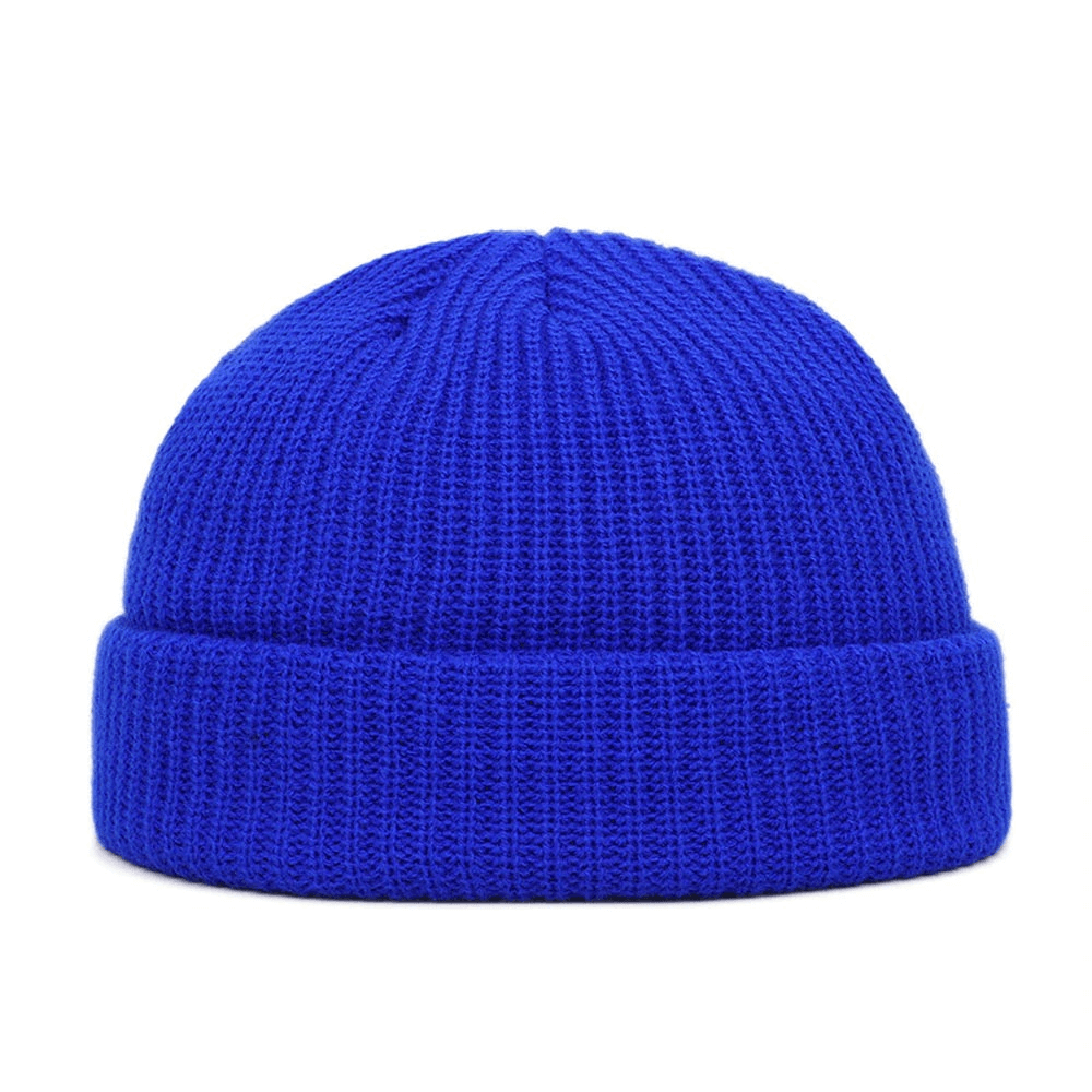Bright blue wool knitted skull beanie for men, stylish and warm casual accessory.