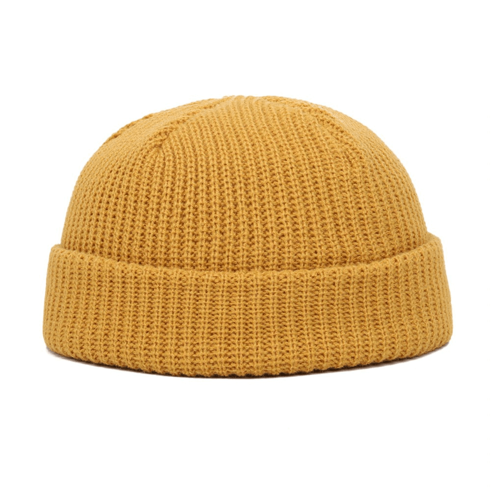 Warm golden knitted skull beanie for men, perfect casual accessory for comfort and style.