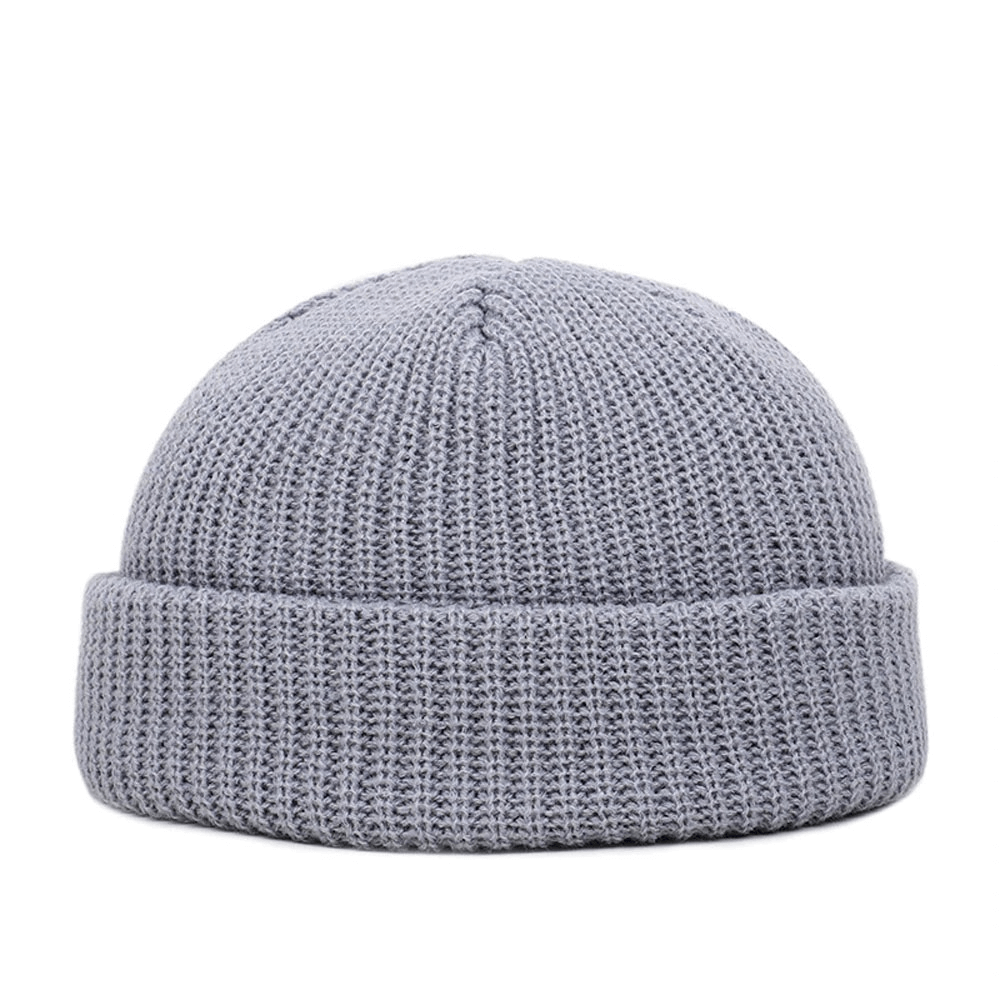 Stylish grey wool knitted skull beanie, perfect warm accessory for men, featuring a casual design.