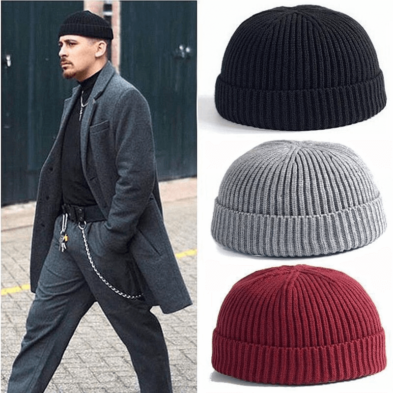 Stylish male model wearing a wool skull beanie, showcasing black, gray, and burgundy beanie options for men.