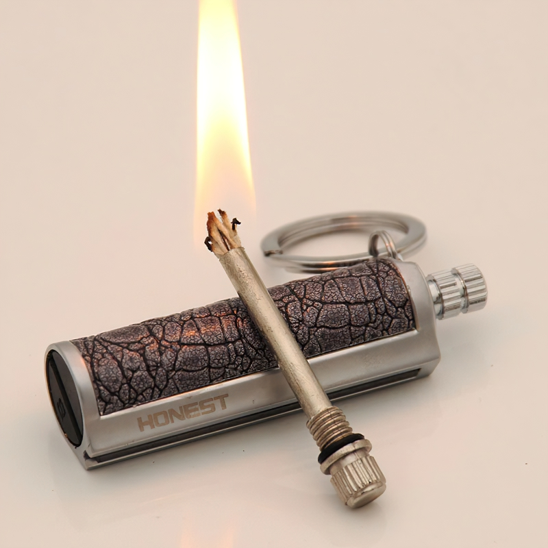 Waterproof kerosene lighter with chic vintage design, keychain-style for easy carrying, ignited and ready for use.
