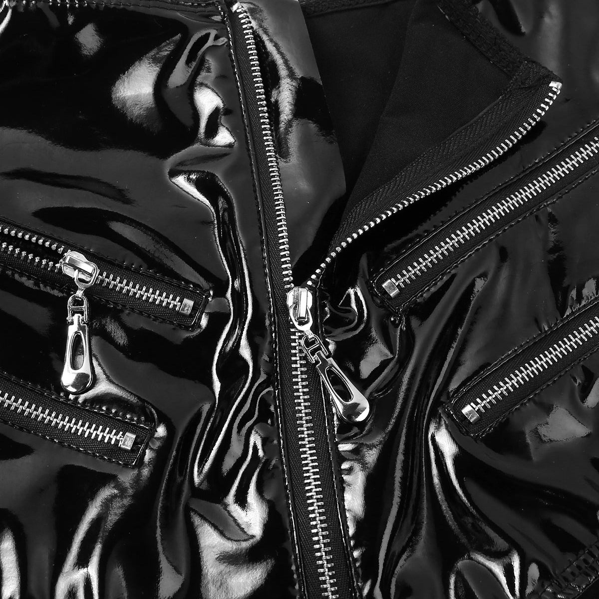 Close-up of glossy black leather high-waisted shorts with zipper details, perfect for rock chick style enthusiasts.
