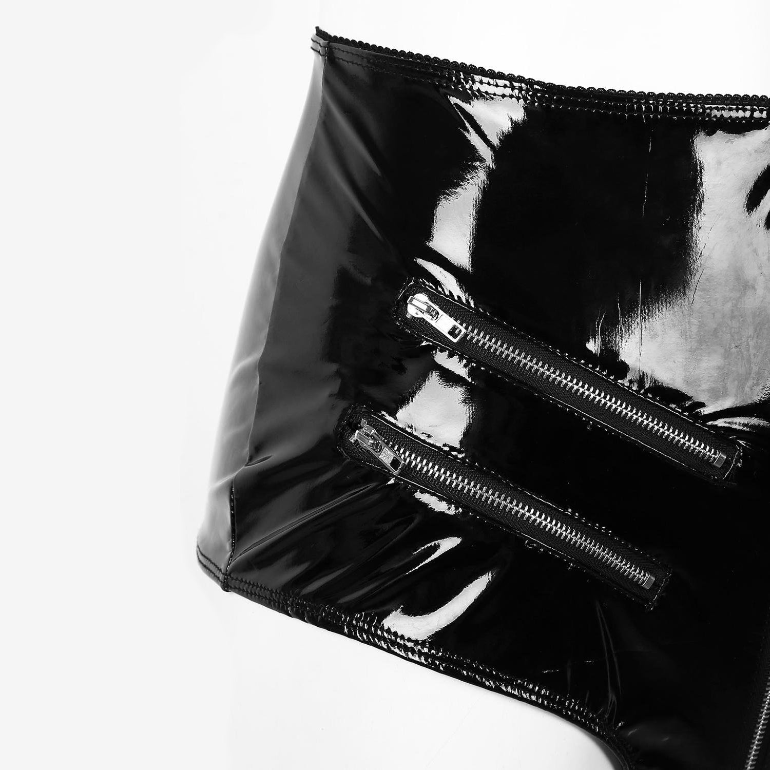 Close-up of glossy high-waisted latex shorts with stylish zipper details, perfect for a rock chick gothic look.