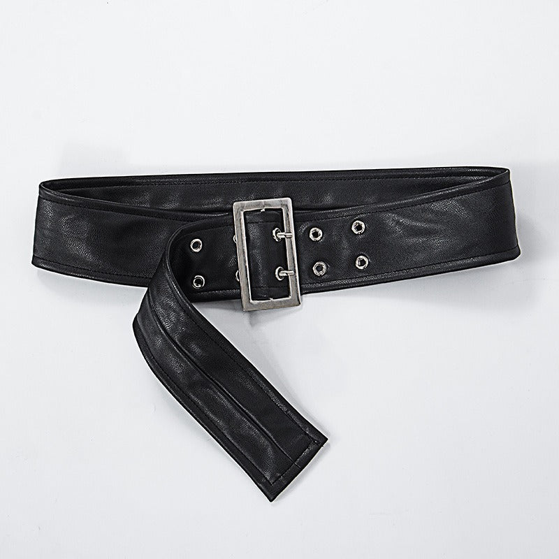 Wide black leather belt with a silver buckle and grommet detailing, perfect for adding a Gothic touch to any outfit.