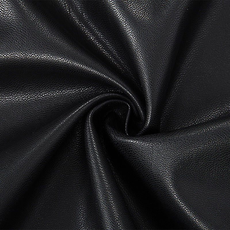 Close-up of soft black fabric, showcasing its smooth, shiny texture, ideal for Gothic-style designs.