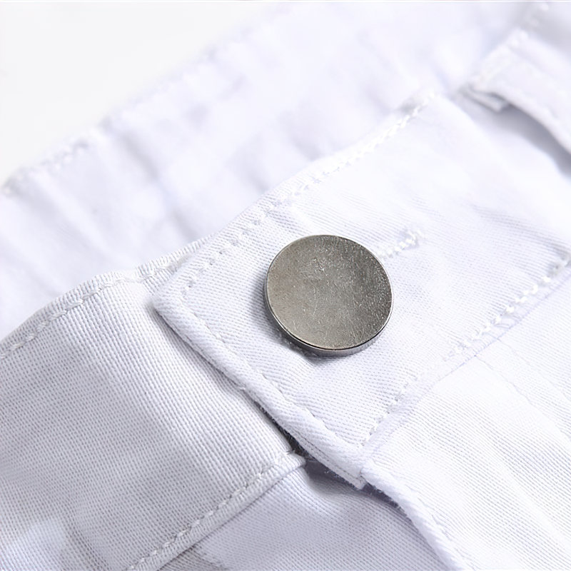 Close-up of white jeans waistband with metal button detail for stylish rock-inspired look.