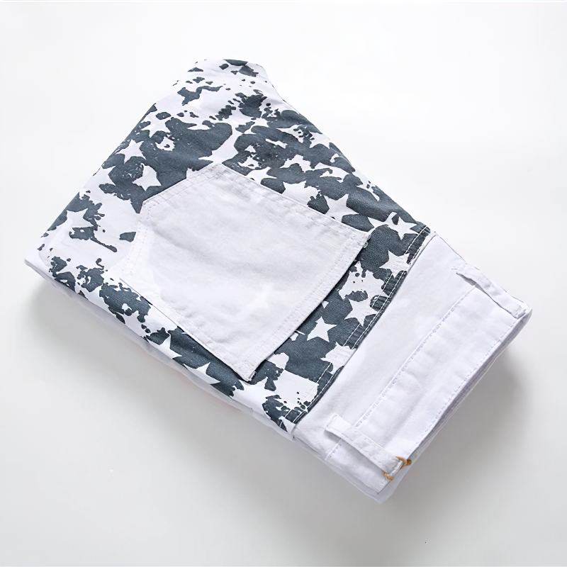 Folded white jeans with USA flag print, featuring a stylish rock design and denim fabric for comfy wear.