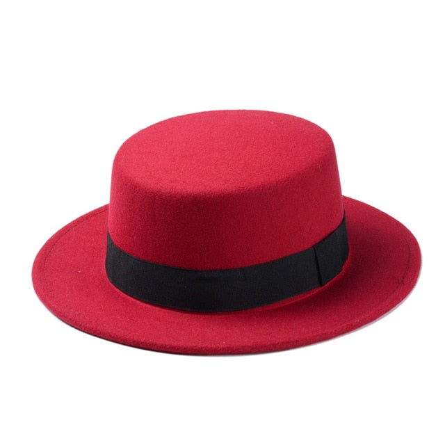 Red wide brim gambler hat with black ribbon, stylish flat top fedora for unique alternative fashion.