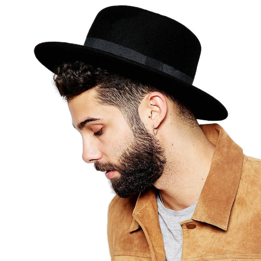 Stylish man wearing a black Wide Brim Gambler Hat with flat top and black ribbon for a chic alternative fashion look.