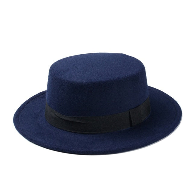 Wide brim flat top fedora hat for women in navy blue, perfect for alternative fashion and cold weather style.
